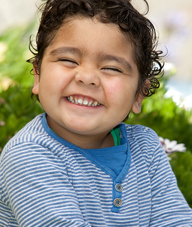 A young child smiling